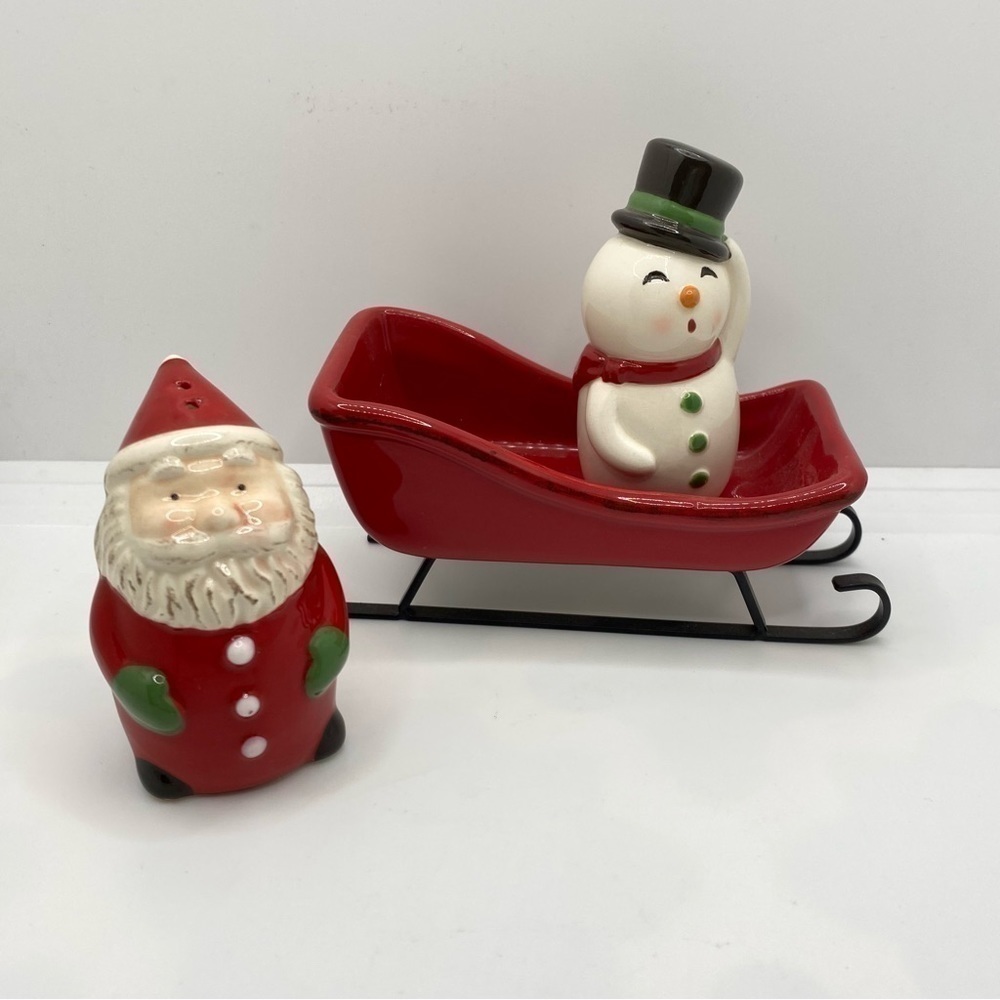 Santa and snowman in A sleigh salt and pepper shaker 3 piece set